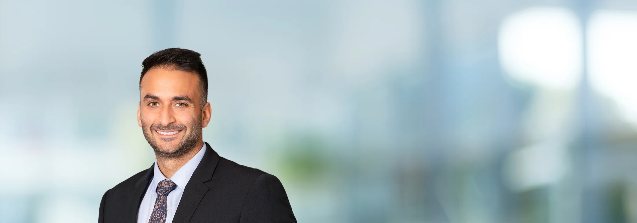 A photo of attorney Leo Setian against a softly blurred office background