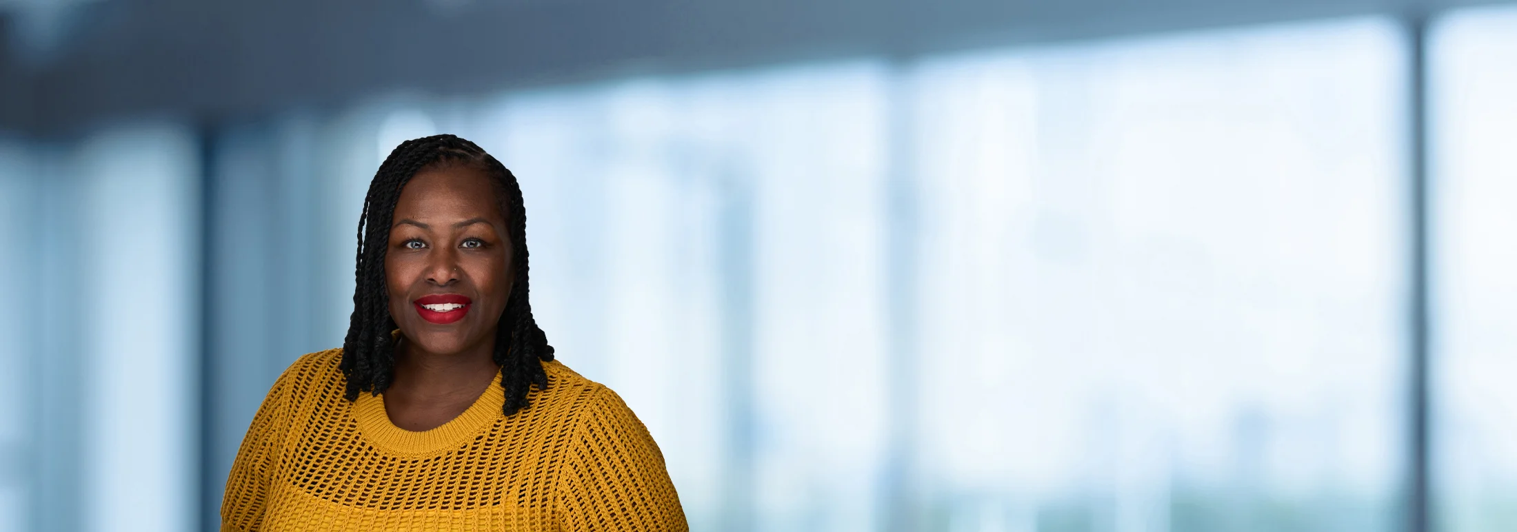 A photo of attorney Terina Williams against a softly blurred office background