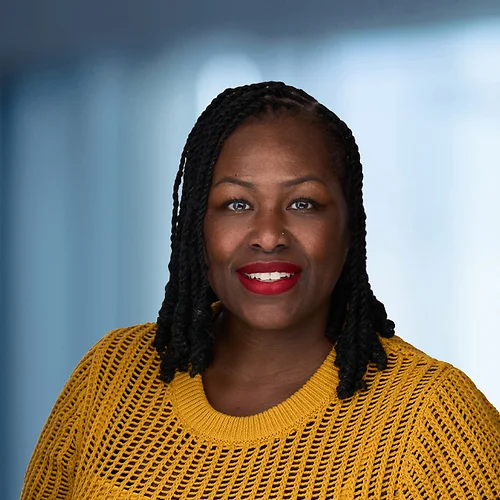A photo of attorney Terina Williams against a softly blurred office background