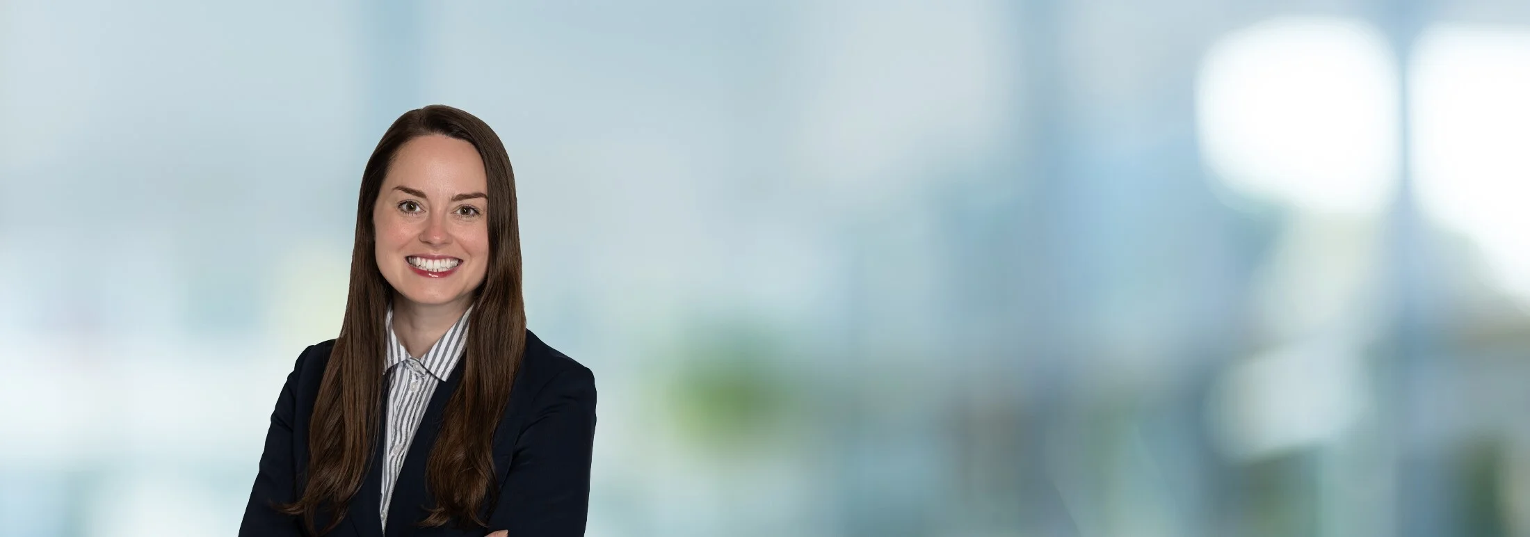 A photo of attorney Haley Miller against a softly blurred office background.