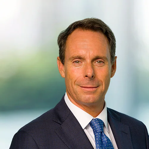 A photo of attorney Chuck Seyfarth against a softly blurred office background