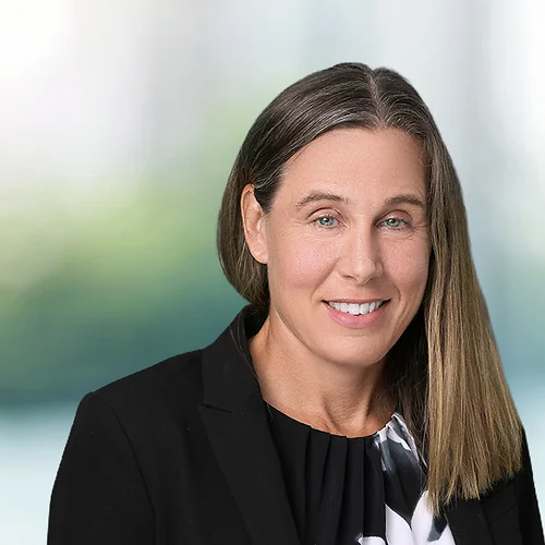 A photo of attorney, Katie Jones, against a softly blurred office background.