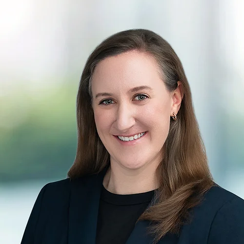 A photo of attorney Laura Free against a softly blurred office background