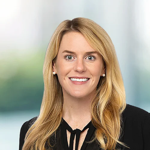 A photo of attorney, Lea McBryde, against a softly blurred office background.