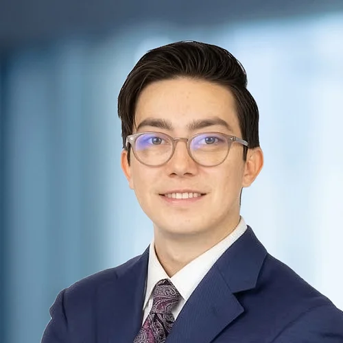 A photo of attorney Ethan Moos against a softly blurred office background