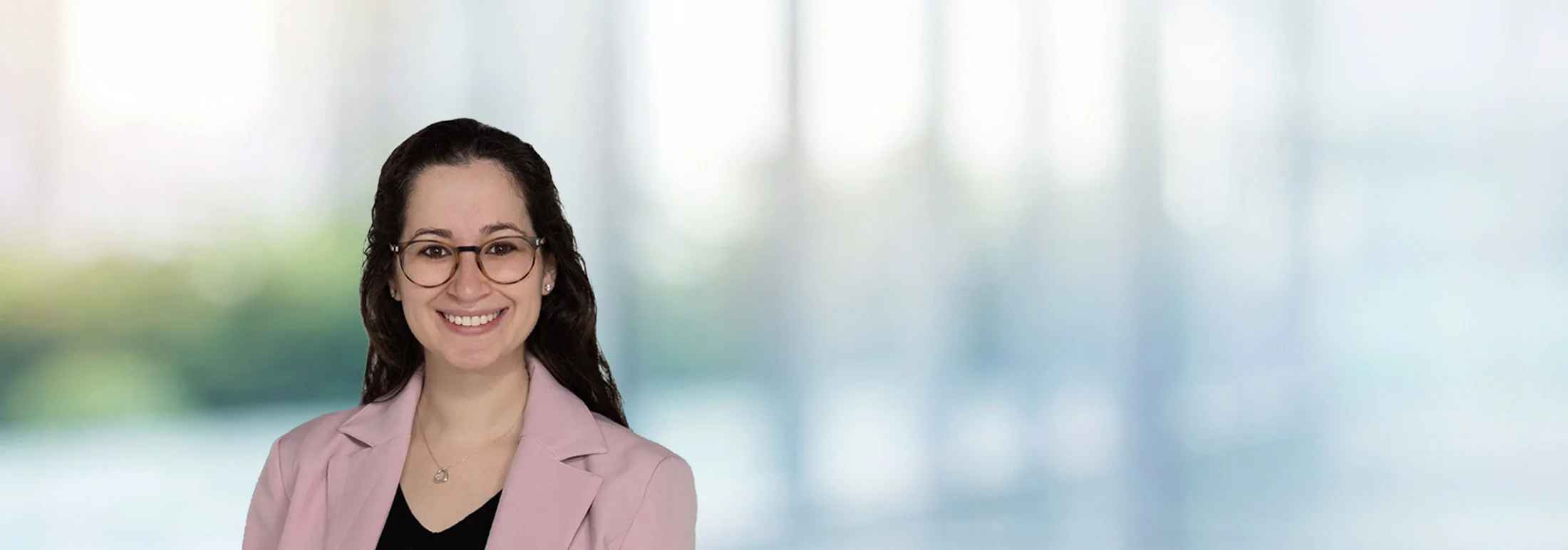 A photo of attorney Rikki Edelman against a softly blurred office background