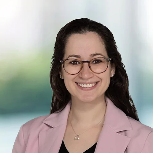 A photo of attorney Rikki Edelman against a softly blurred office background
