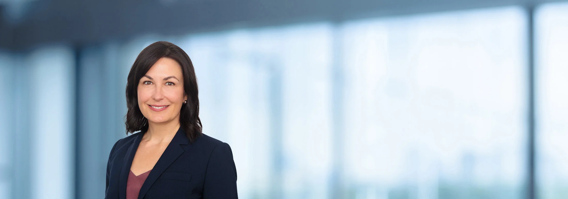 A photo of attorney Marissa Hornsby against a softly blurred office background