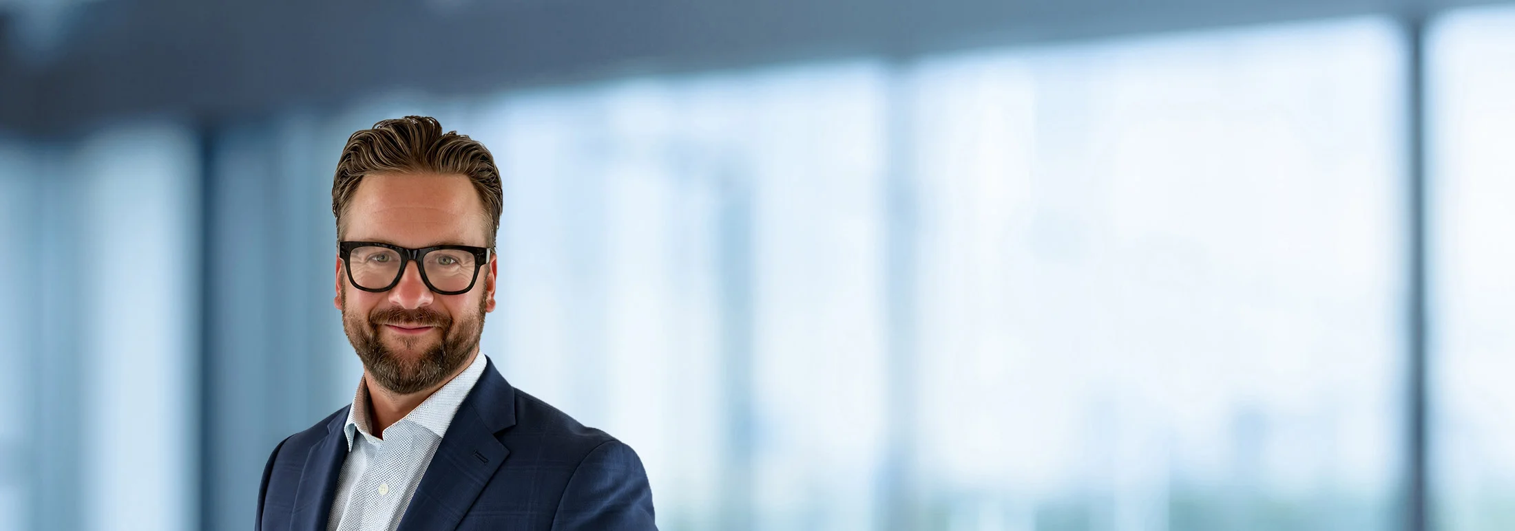 A photo of attorney Dan Stillman against a softly blurred office background