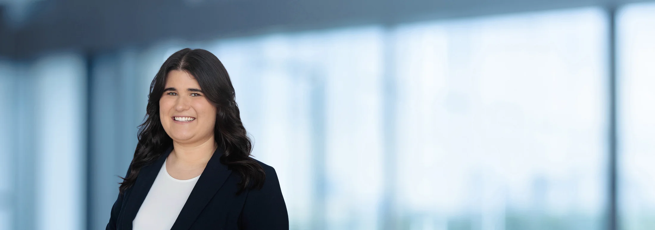 A photo of attorney Emily Walker against a softly blurred office background