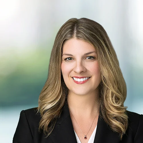 A photo of attorney, Clarissa Pintado, against a softly blurred office background.