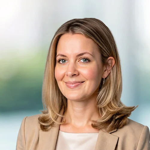 A photo of attorney Hilarie Carhill against a softly blurred office background