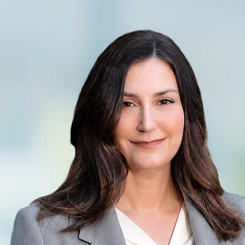 A photo of attorney Kasey Myhra against a softly blurred office background