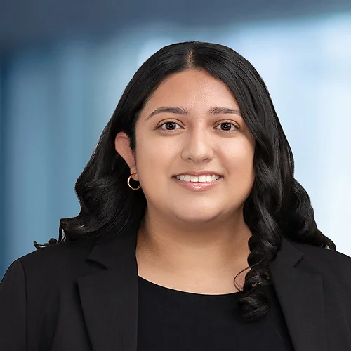 A photo of attorney Alyssa Castrillon against a softly blurred office background