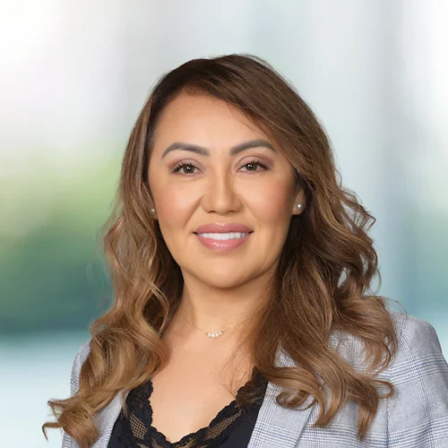 A photo of attorney, Susana Solano, against a softly blurred office background