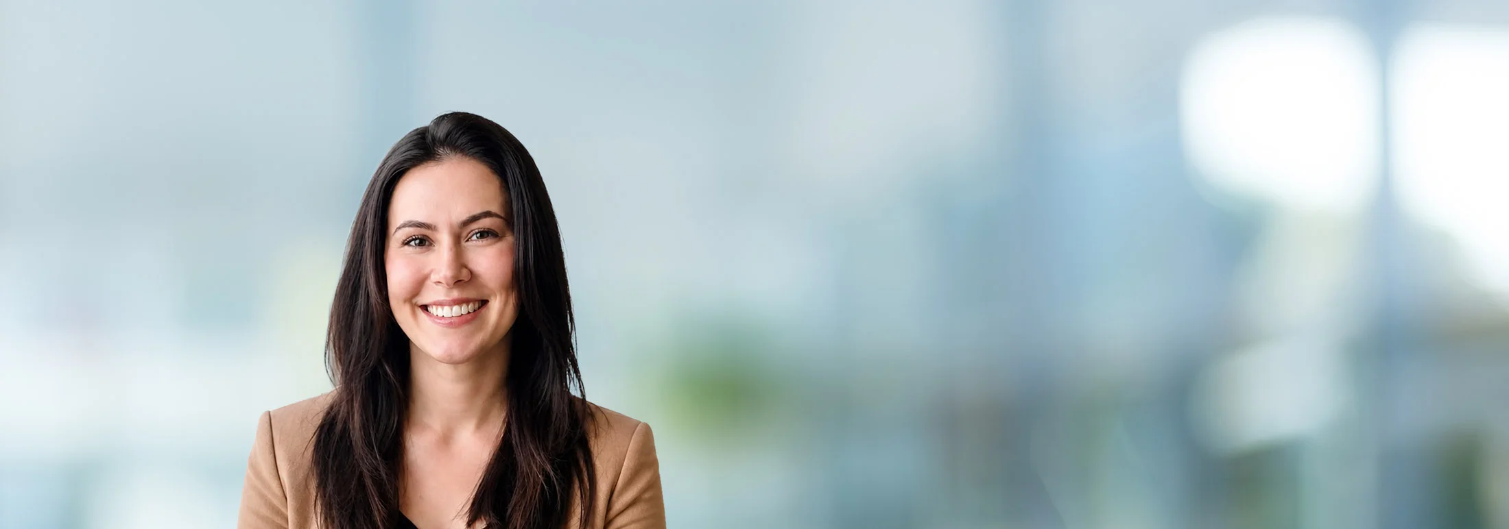 A photo of attorney, Shannon Prokop, against a softly blurred office background