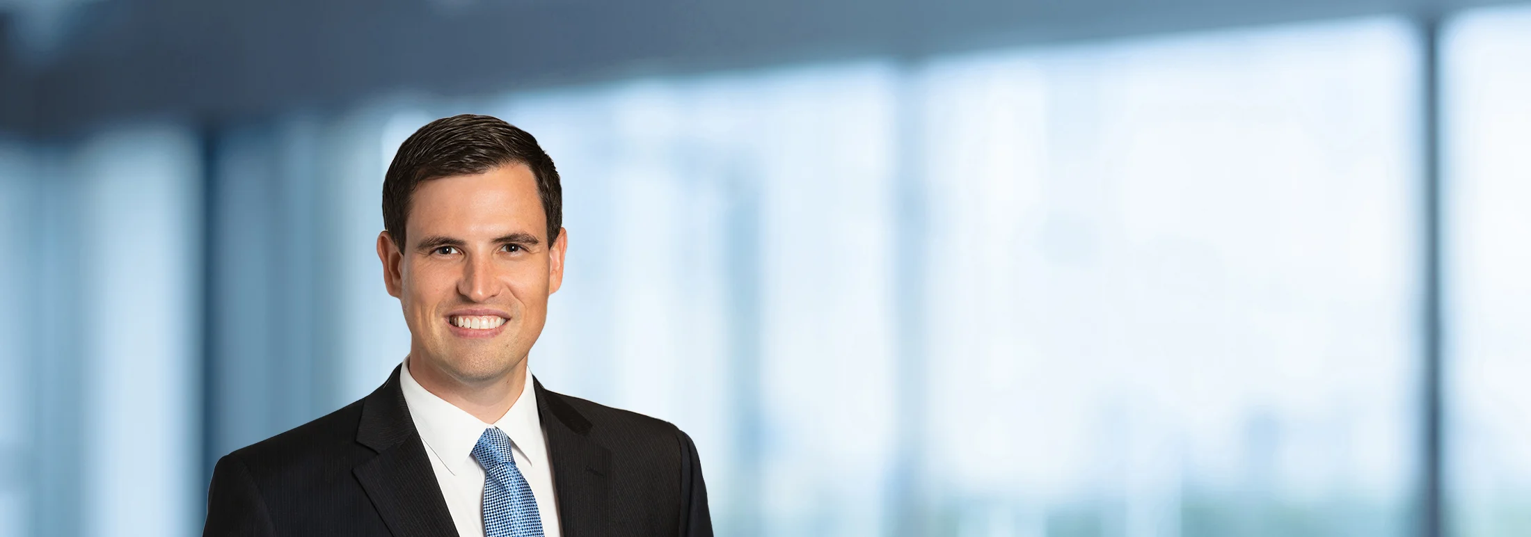 A photo of attorney, Michael Kessler, against a softly blurred office background