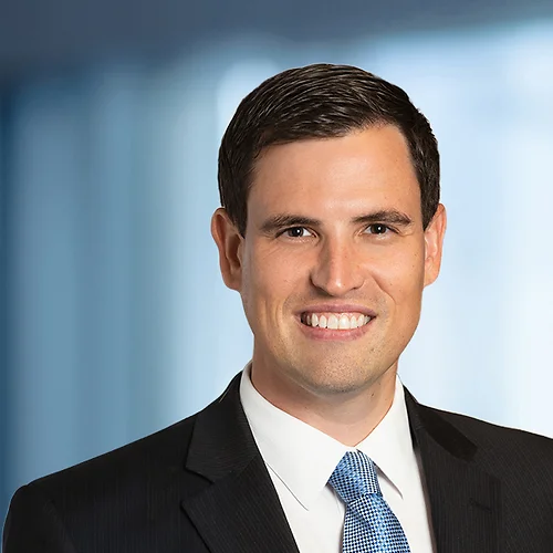 A photo of attorney, Michael Kessler, against a softly blurred office background