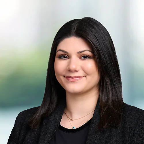 A photo of attorney, Kristen Mullis, against a softly blurred office background.