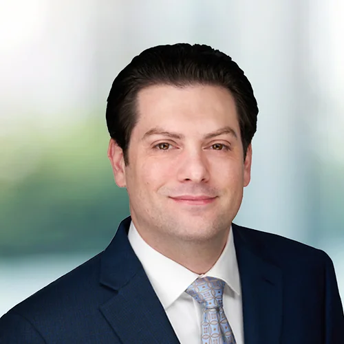 A photo of attorney Brad Bergman against a softly blurred office background