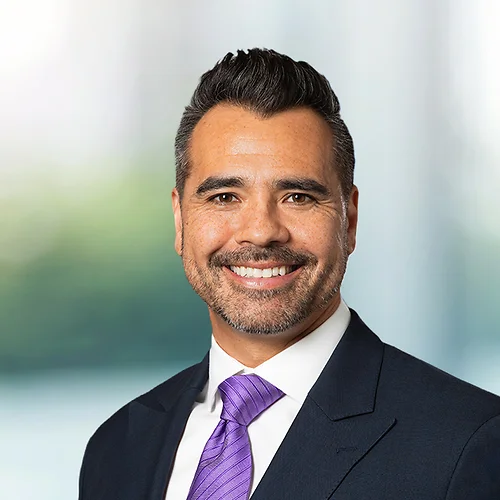 A photo of attorney Vincent Fisher against a softly blurred office background