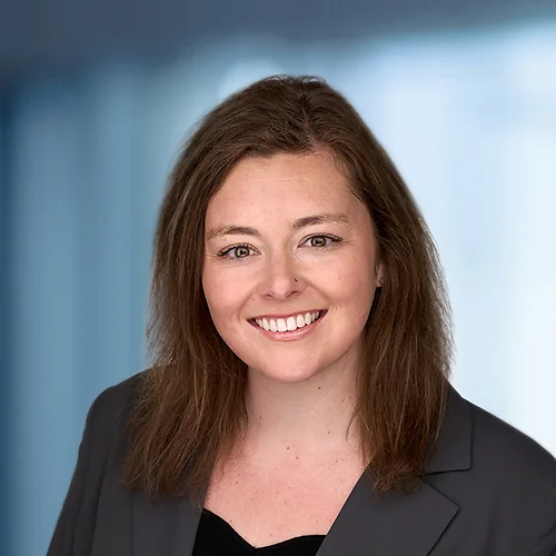 A photo of attorney Annie Hatton against a softly blurred office background