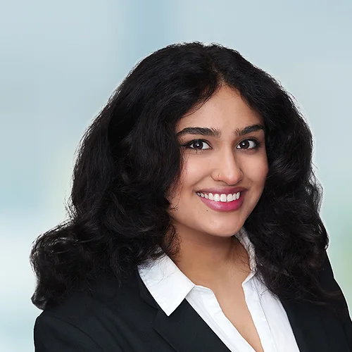 A photo of attorney Jannat Irshad against a softly blurred office background