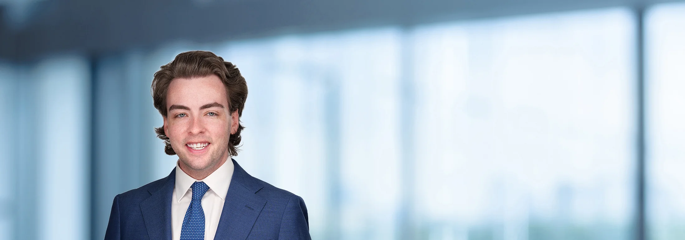 A photo of attorney Jack O'Hollearn against a softly blurred office background