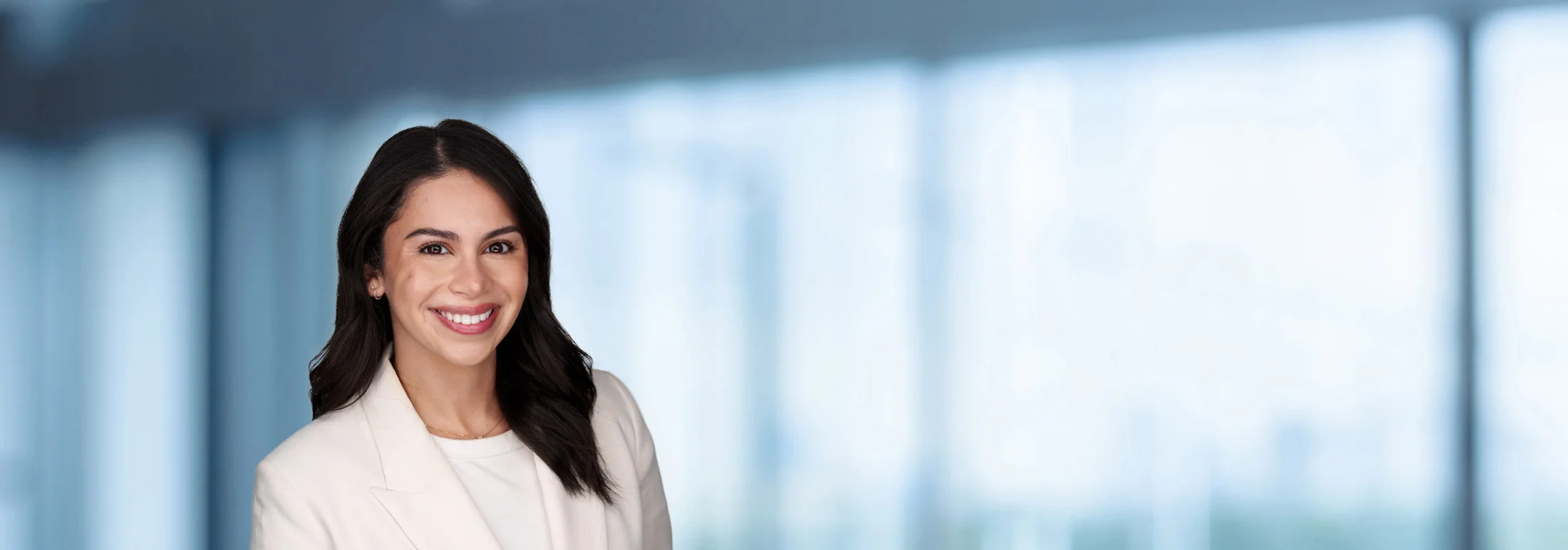 A photo of attorney Shaida Shahinfar against a softly blurred office background