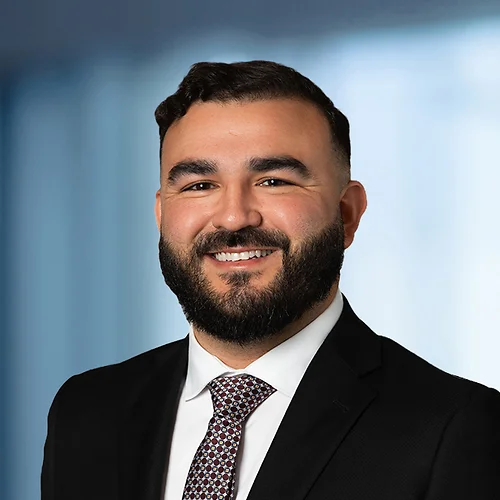 A photo of attorney Cruz Zavala against a softly blurred office background