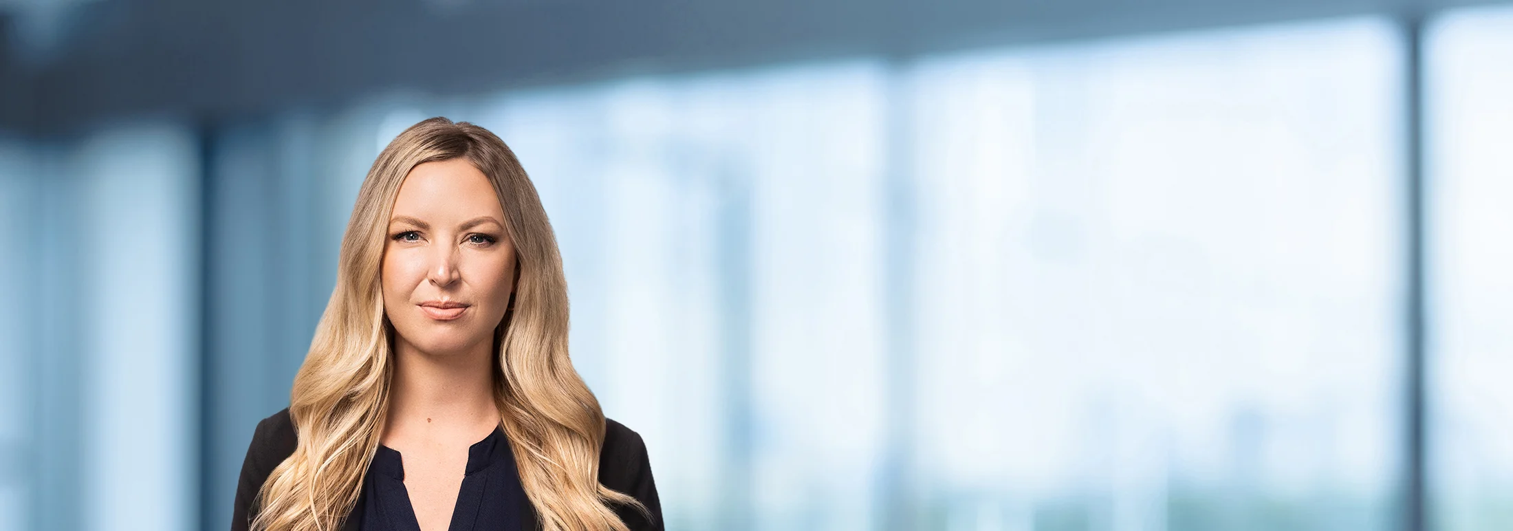 A photo of attorney Elaine McCormick against a softly blurred office background
