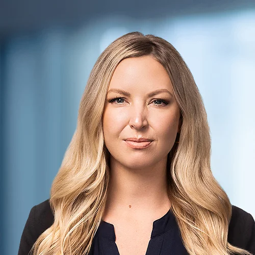 A photo of attorney Elaine McCormick against a softly blurred office background