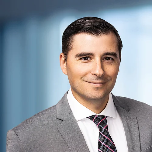 A photo of attorney, Anthony Oceguera, against a softly blurred office background