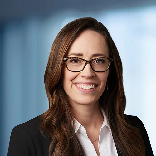 A photo of attorney, Amanda Bryan, against a softly blurred office background