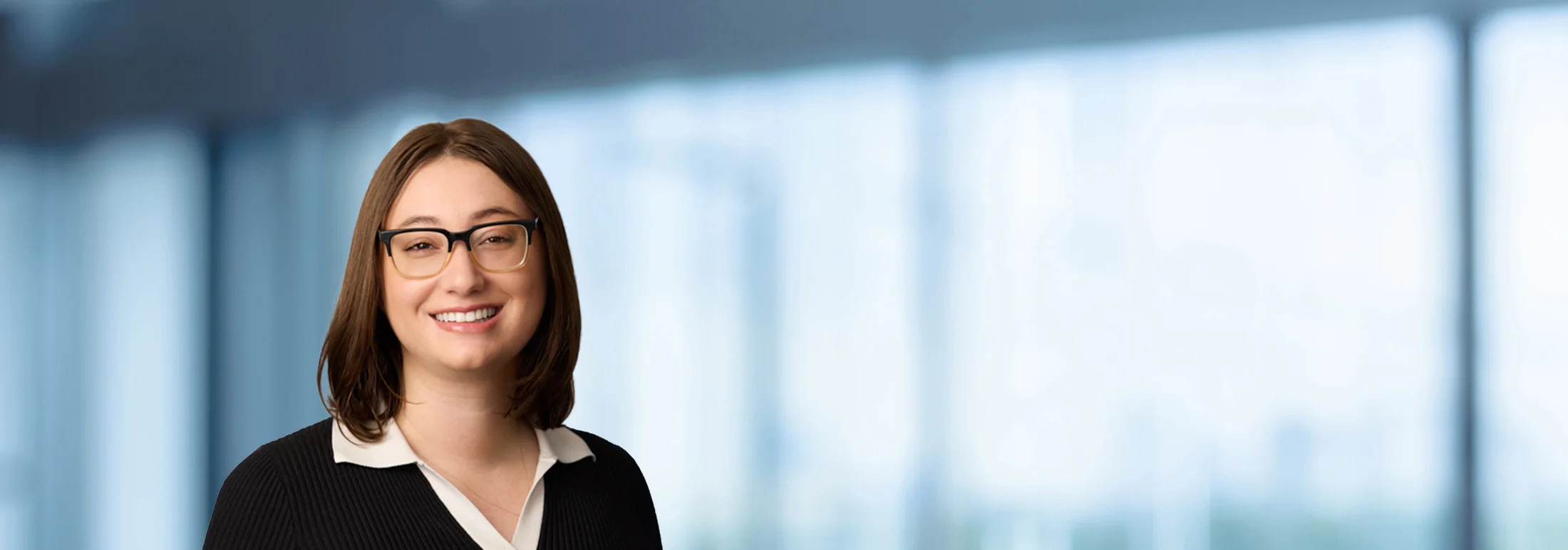 A photo of attorney Megan Bryant-Tiktin against a softly blurred office background