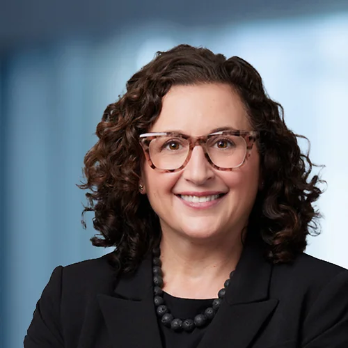 A photo of attorney, Naomi Johnson, against a softly blurred office background