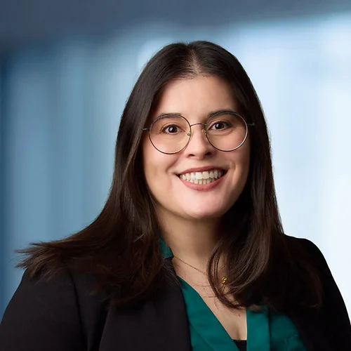 A photo of attorney Tara Mokhtarzadeh against a softly blurred office background