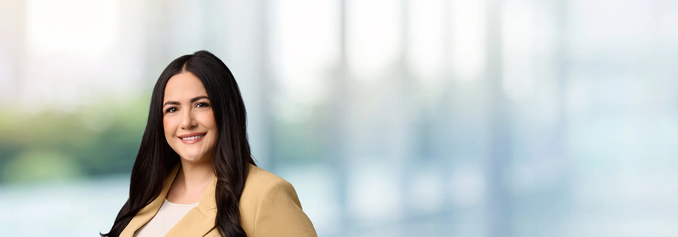 A photo of attorney Elizabeth Petersen against a softly blurred office background