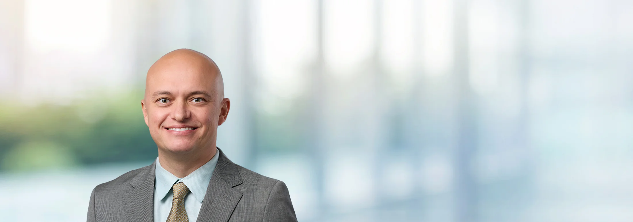 A photo of attorney, Ben Veralrud, against a softly blurred office background