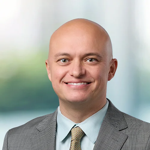 A photo of attorney, Ben Veralrud, against a softly blurred office background