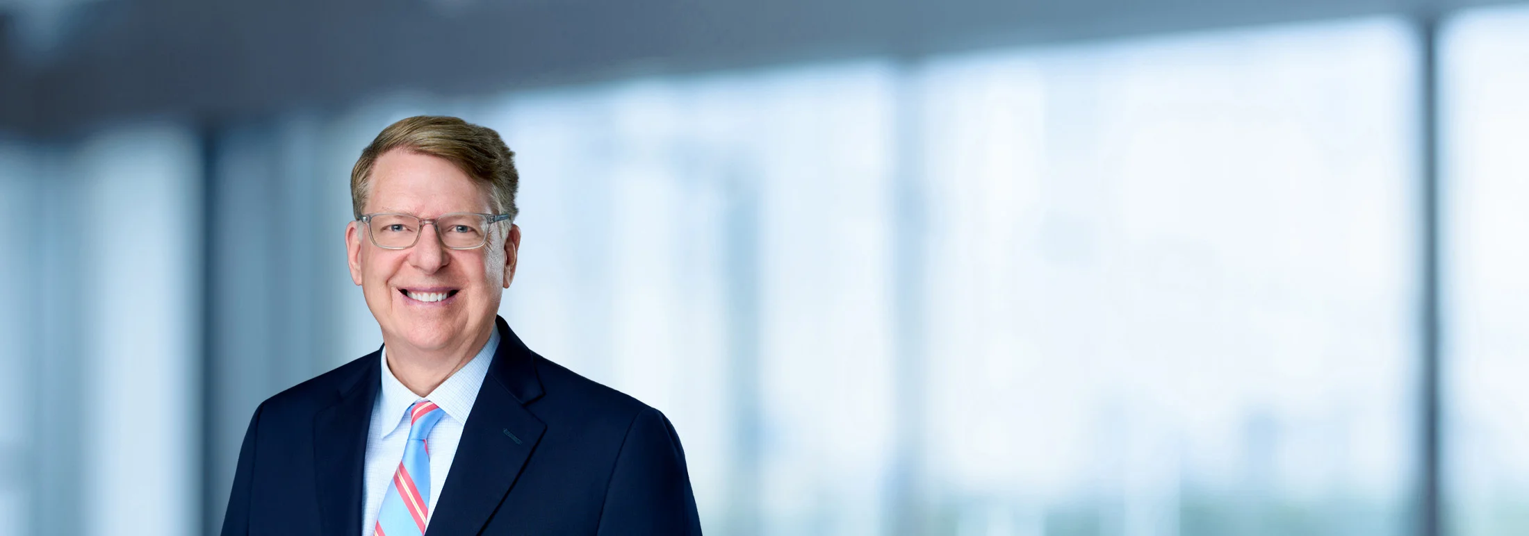 A photo of attorney, James Cosby, against a softly blurred office background