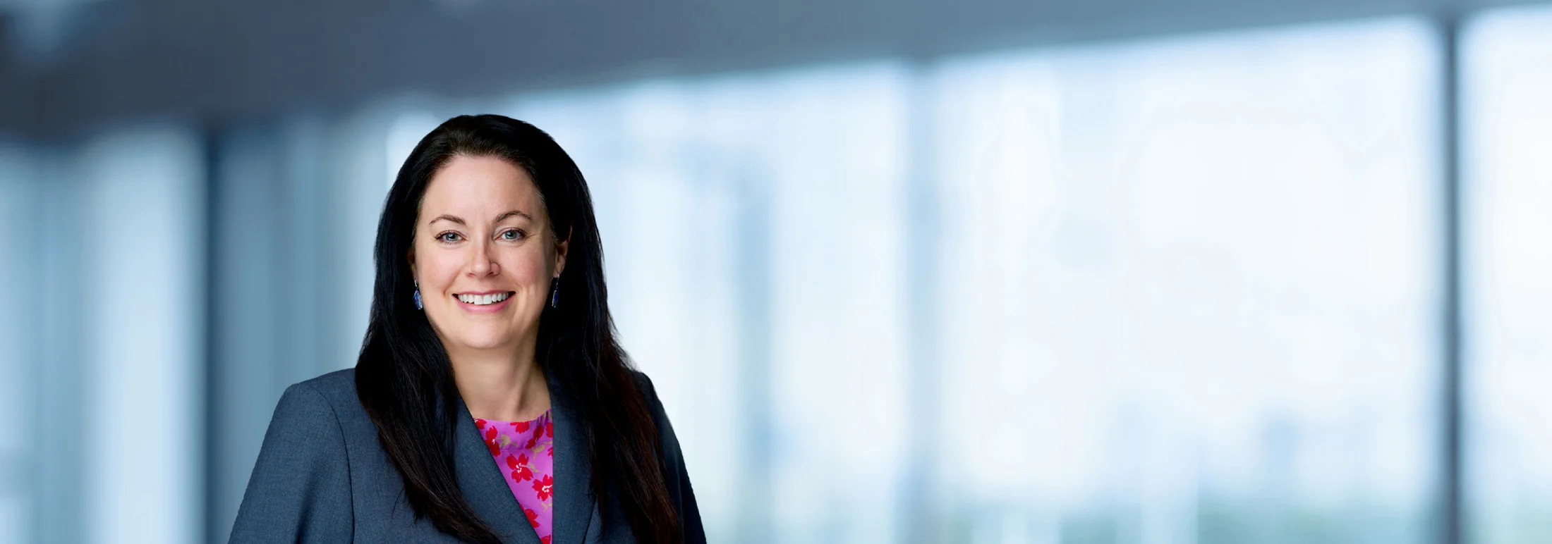 A photo of attorney, Eileen Geller, against a softly blurred office background