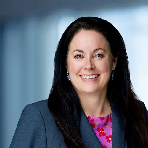 A photo of attorney, Eileen Geller, against a softly blurred office background