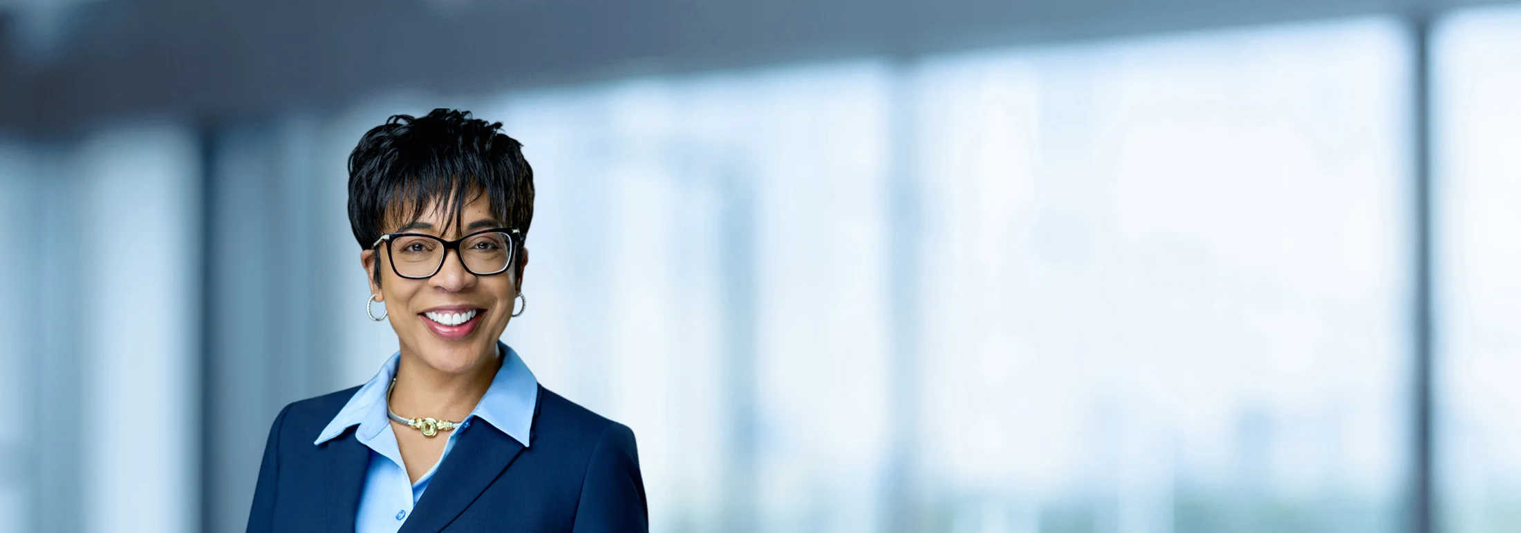 A photo of attorney, Coreen Silverman, against a softly blurred office background