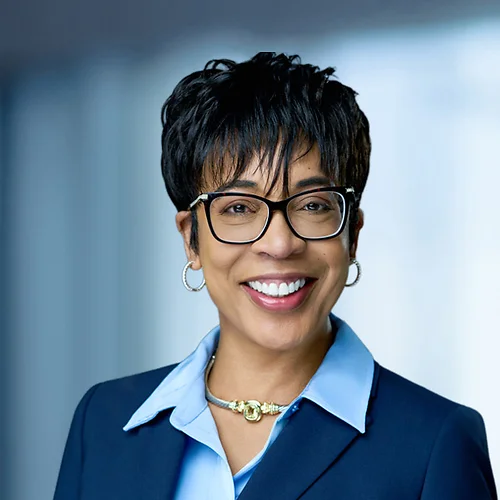 A photo of attorney, Coreen Silverman, against a softly blurred office background