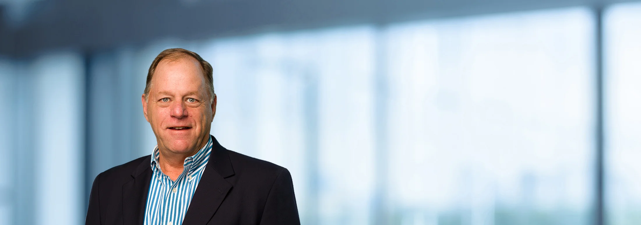 A photo of attorney Robert Yates against a softly blurred office background