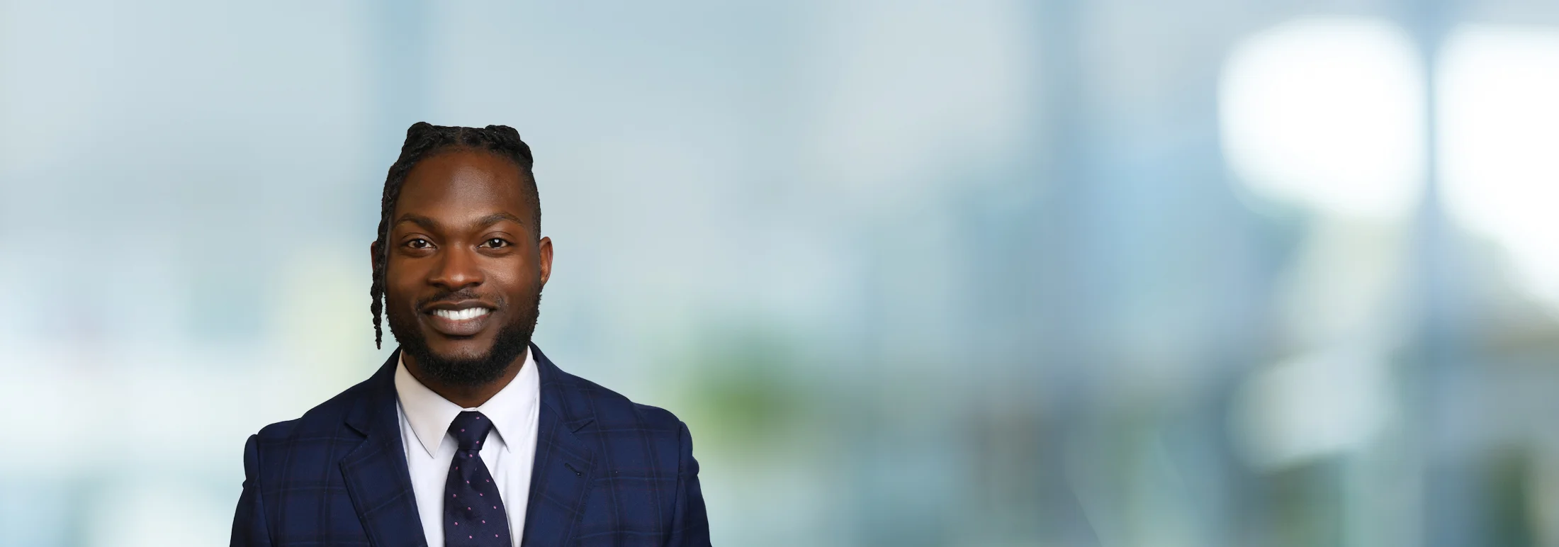 A photo of attorney Bryant Andrews against a softly blurred office background