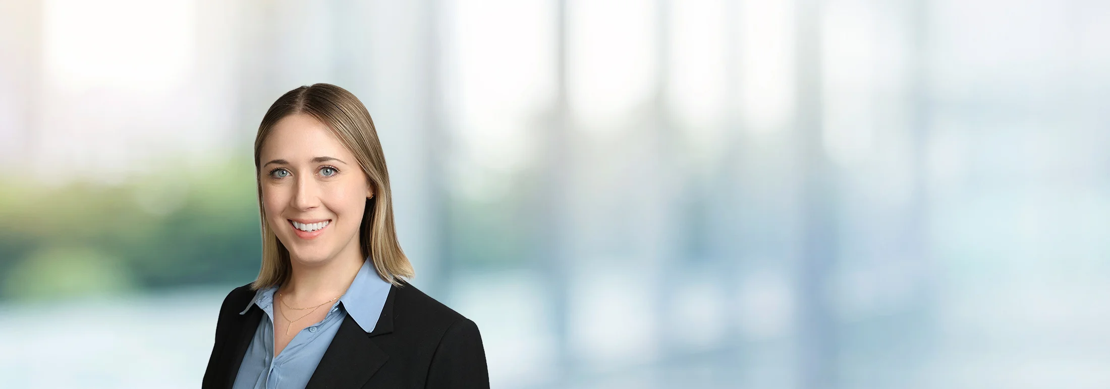 A photo of attorney Elizabeth Castillo against a softly blurred office background