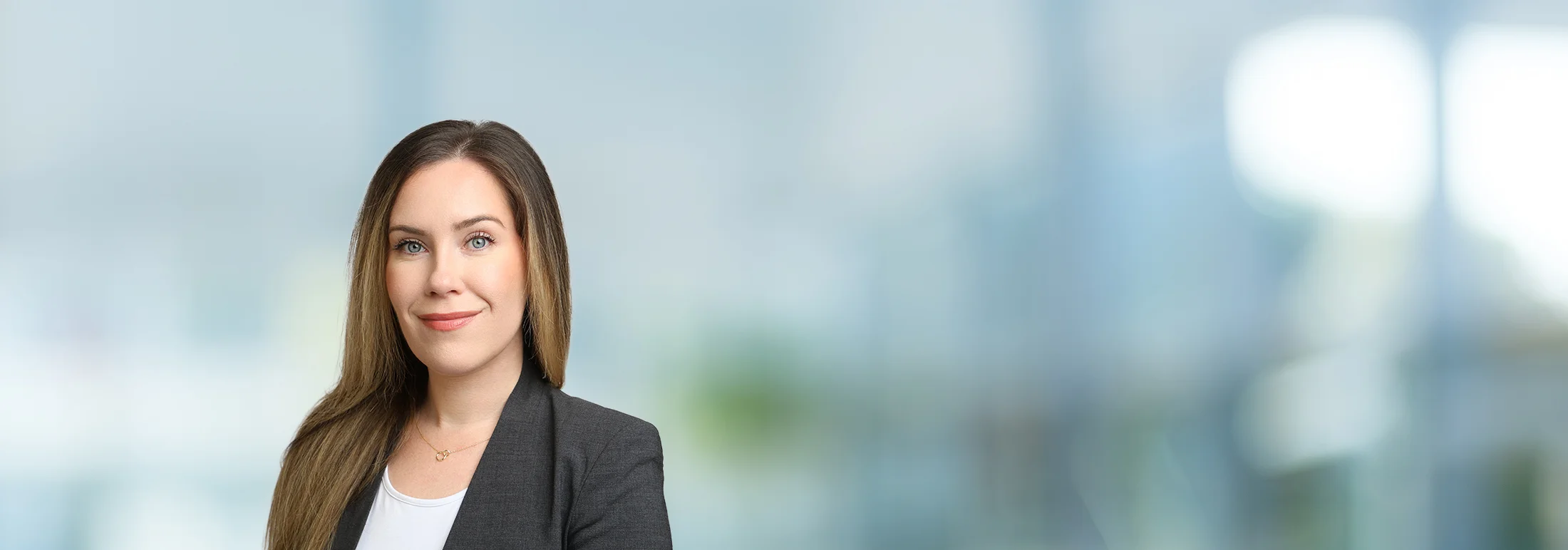 A photo of attorney Alecsandria Cook against a softly blurred office background