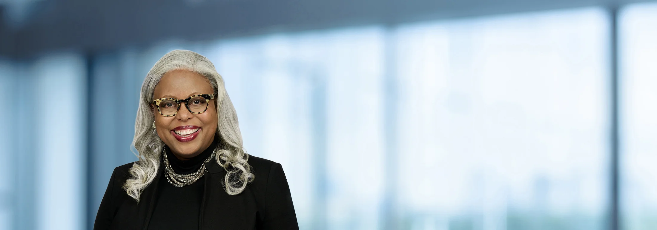 A photo of attorney Michon Crawford against a softly blurred office background
